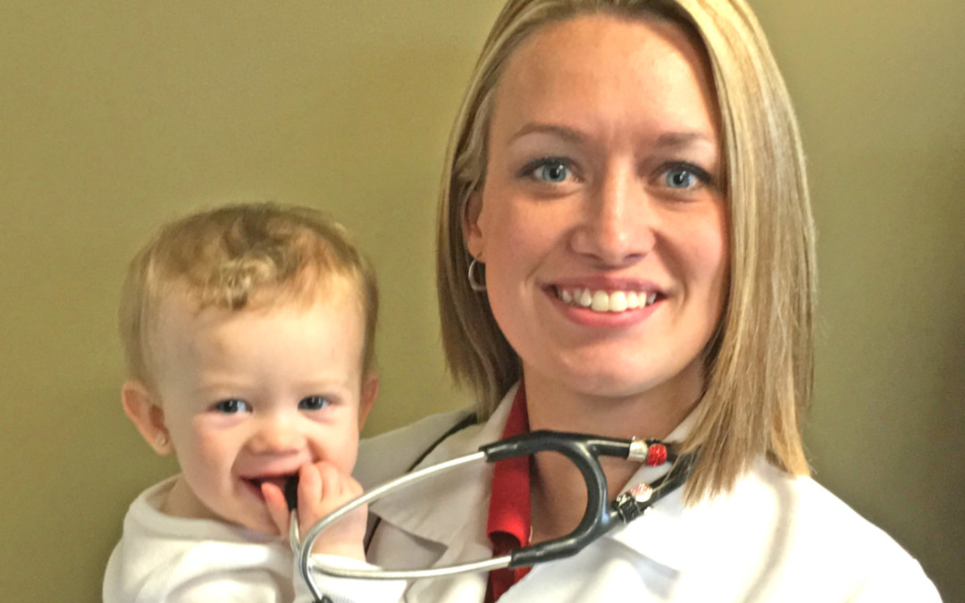 allergy doctor holding toddler